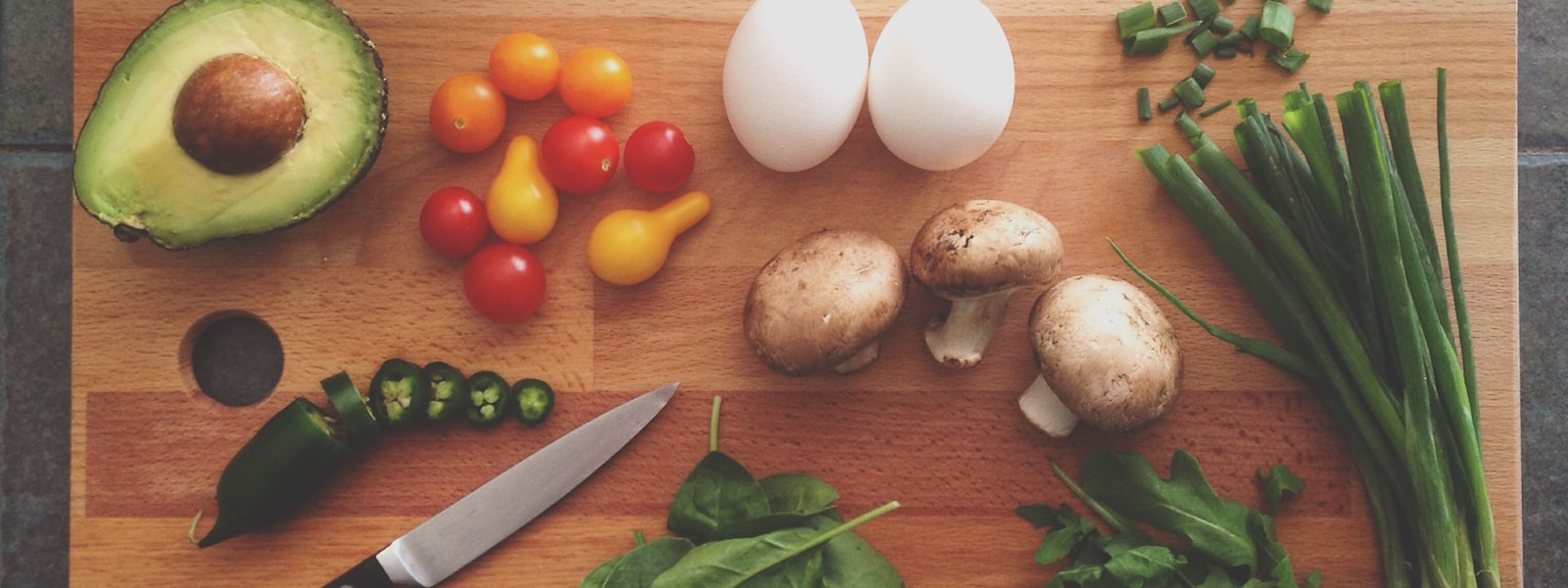 Fresh ingredients on a warm wooden kitchen table